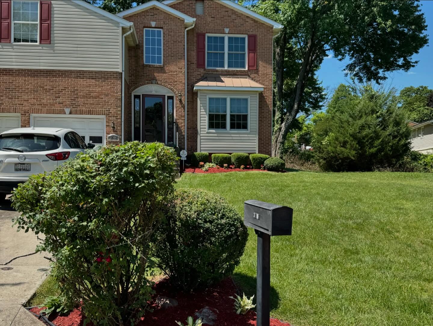 Snow removal crew clearing commercial parking lot